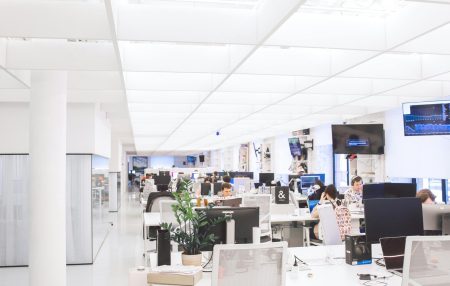 pexels-photo-3778619-3778619 Spacious and well-lit office interior with modern furniture and workstations, ideal for a dynamic work environment.